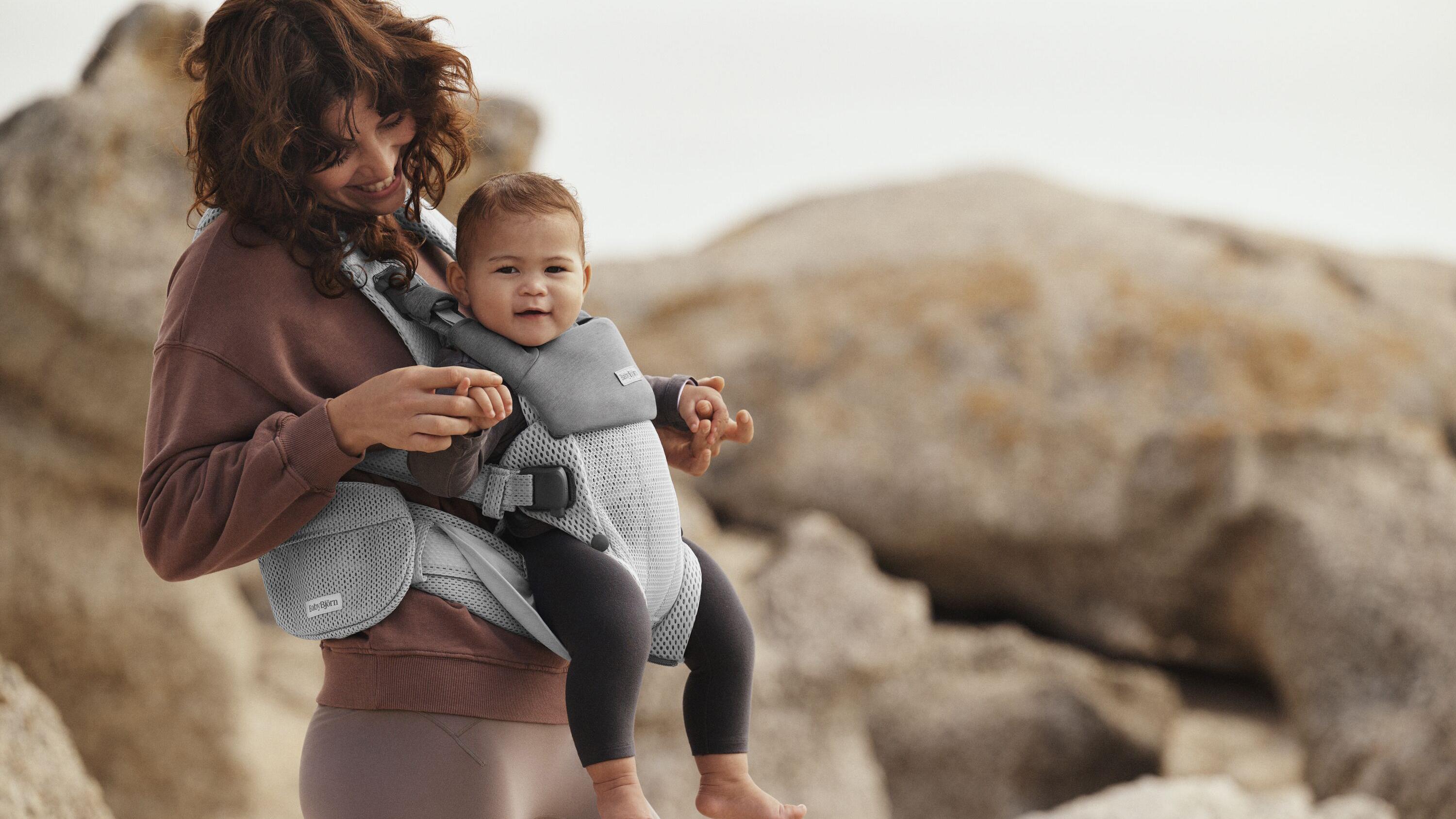 Elevate you baby wearing bib for baby carrier in grey BabyBjörn